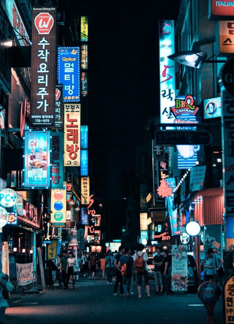 buildings with pathway surround by people